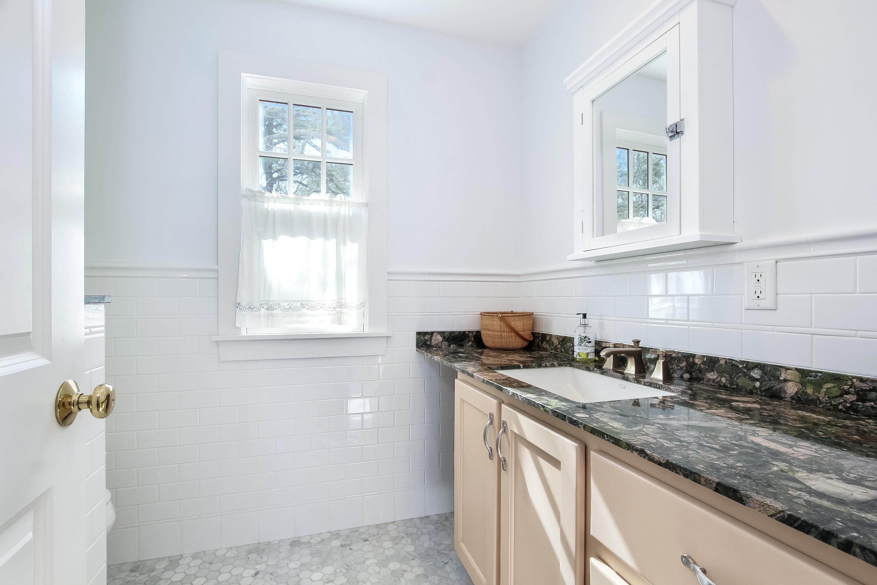 352 Scraggy Neck Road Cataumet, MA 02534 - Photo 15 of 36 a kitchen with granite countertop cabinets appliances and a window