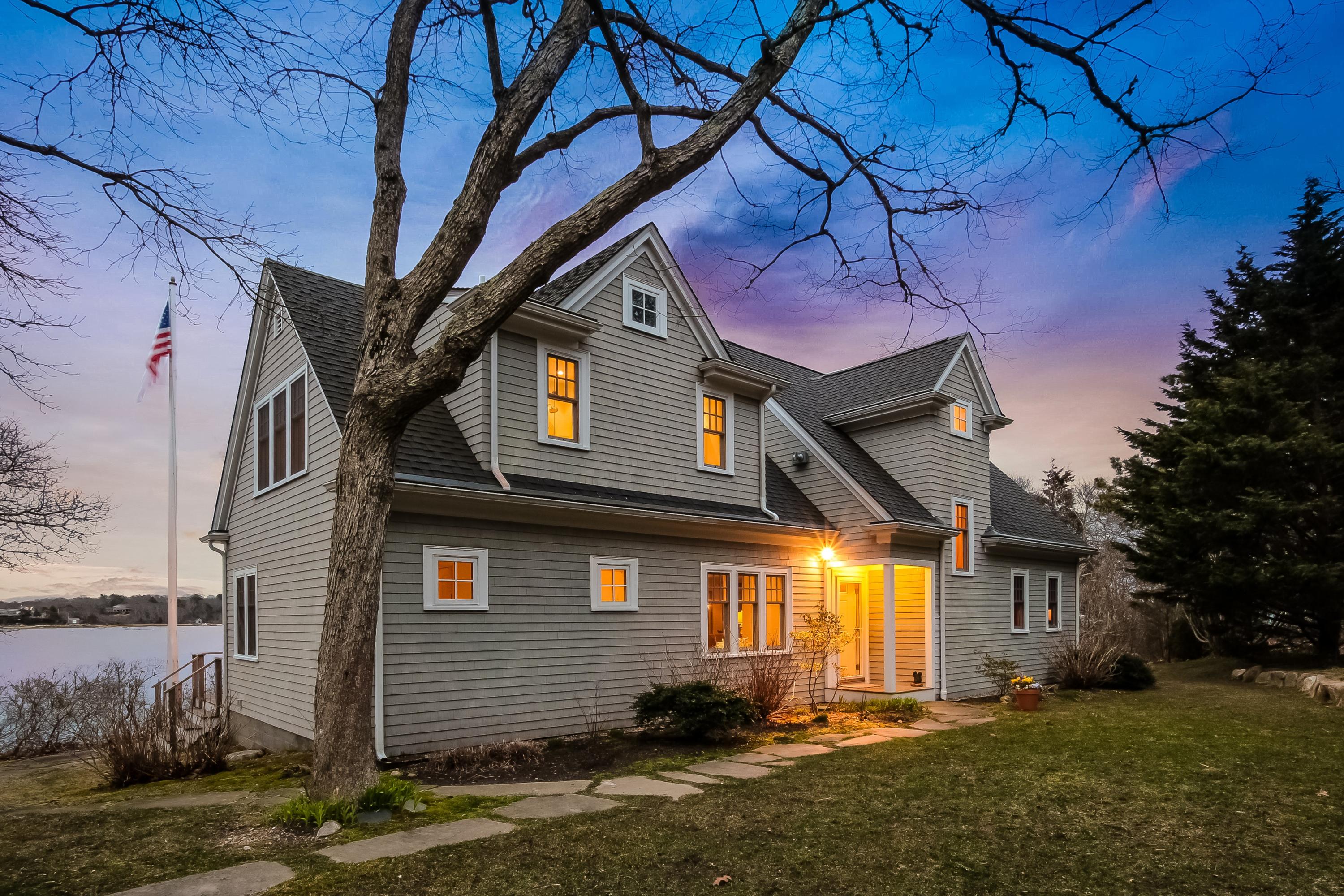 352 Scraggy Neck Road Cataumet, MA 02534 - Photo 30 of 36 a front view of a house with a yard