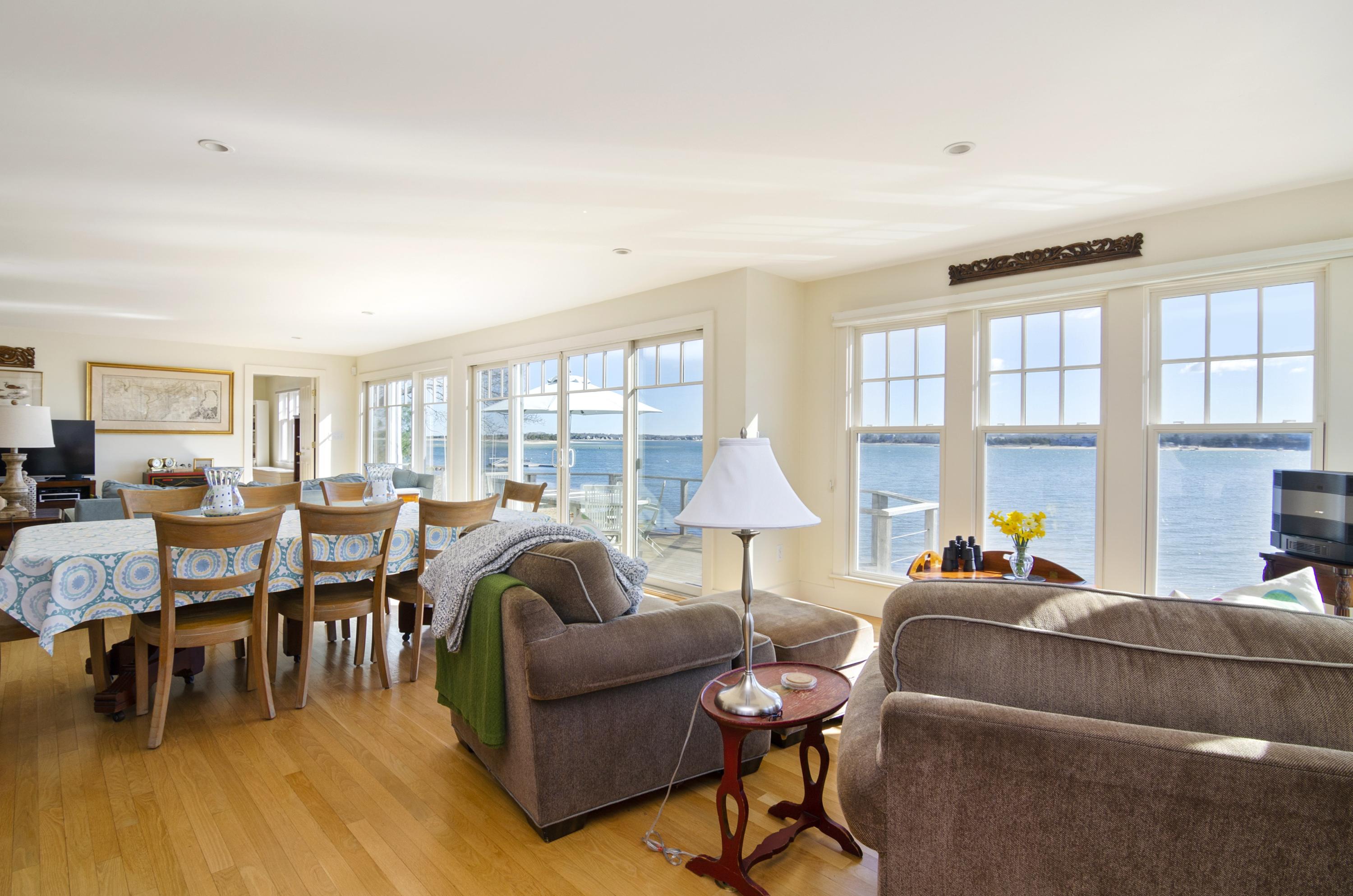 352 Scraggy Neck Road Cataumet, MA 02534 - Photo 3 of 36 a living room with furniture and a large window