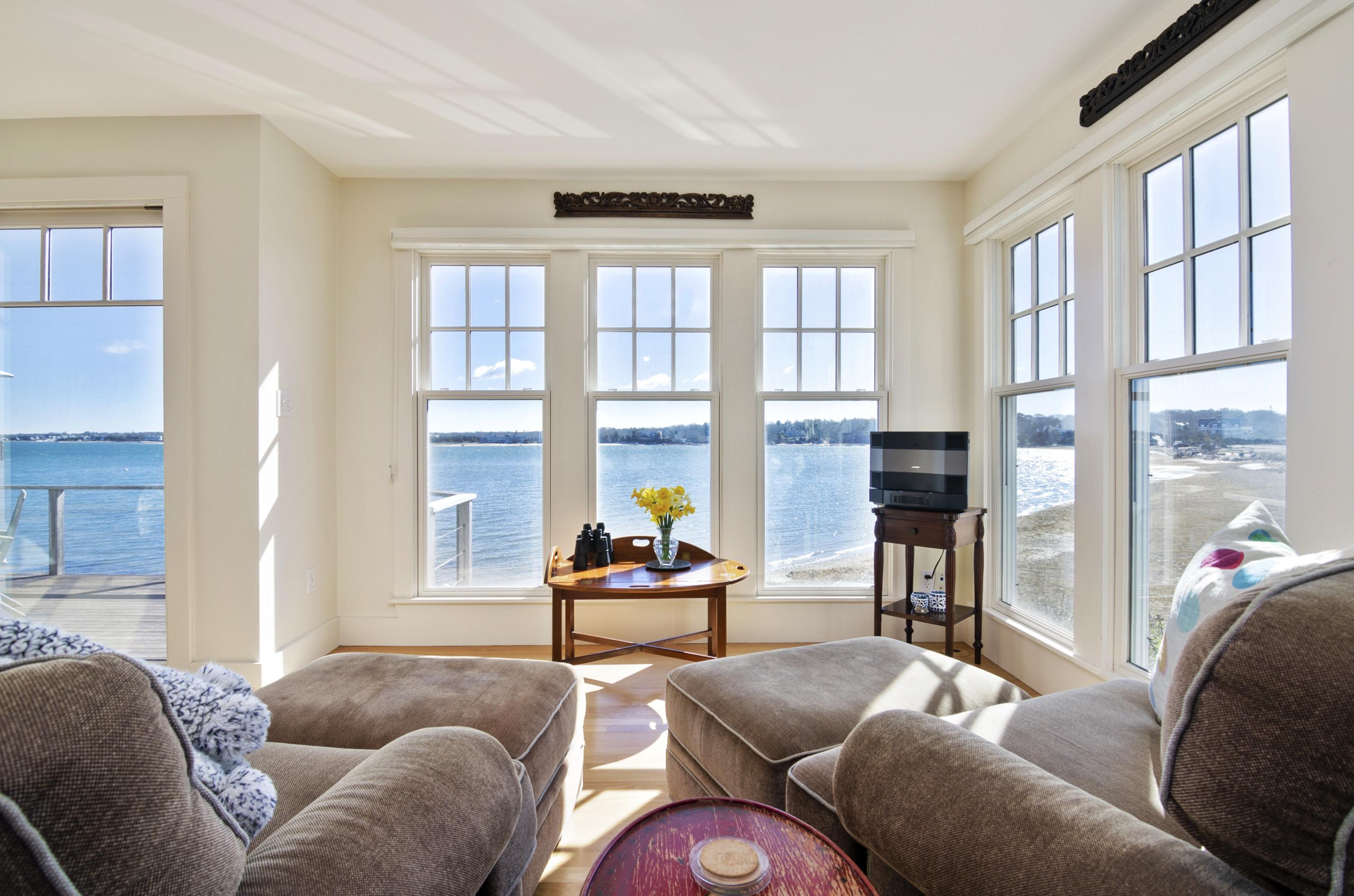 352 Scraggy Neck Road Cataumet, MA 02534 - Photo 4 of 36 a living room with furniture and a floor to ceiling window