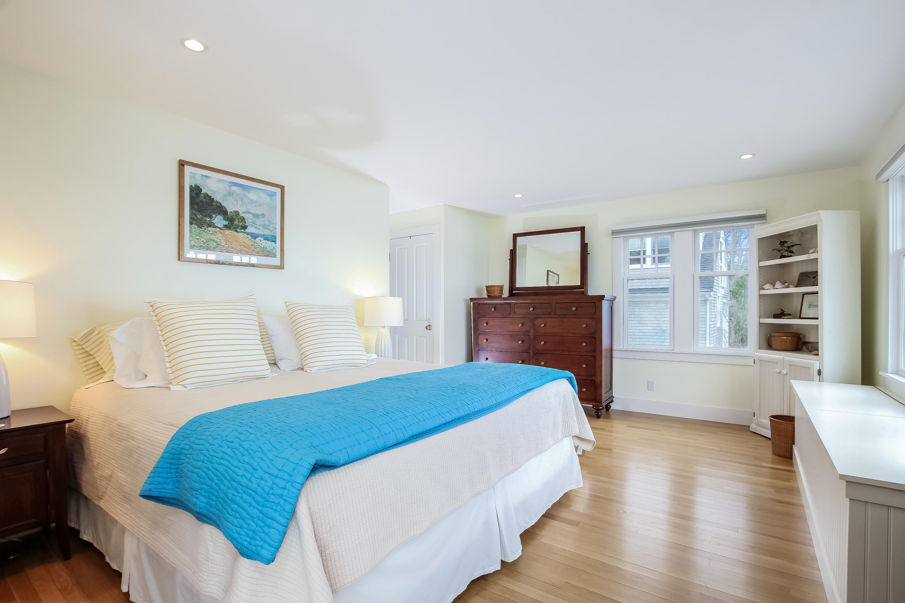 352 Scraggy Neck Road Cataumet, MA 02534 - Photo 6 of 36 a bedroom with a large bed and a couch