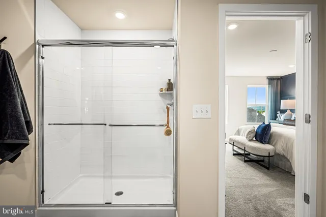 a bathroom with a glass shower door