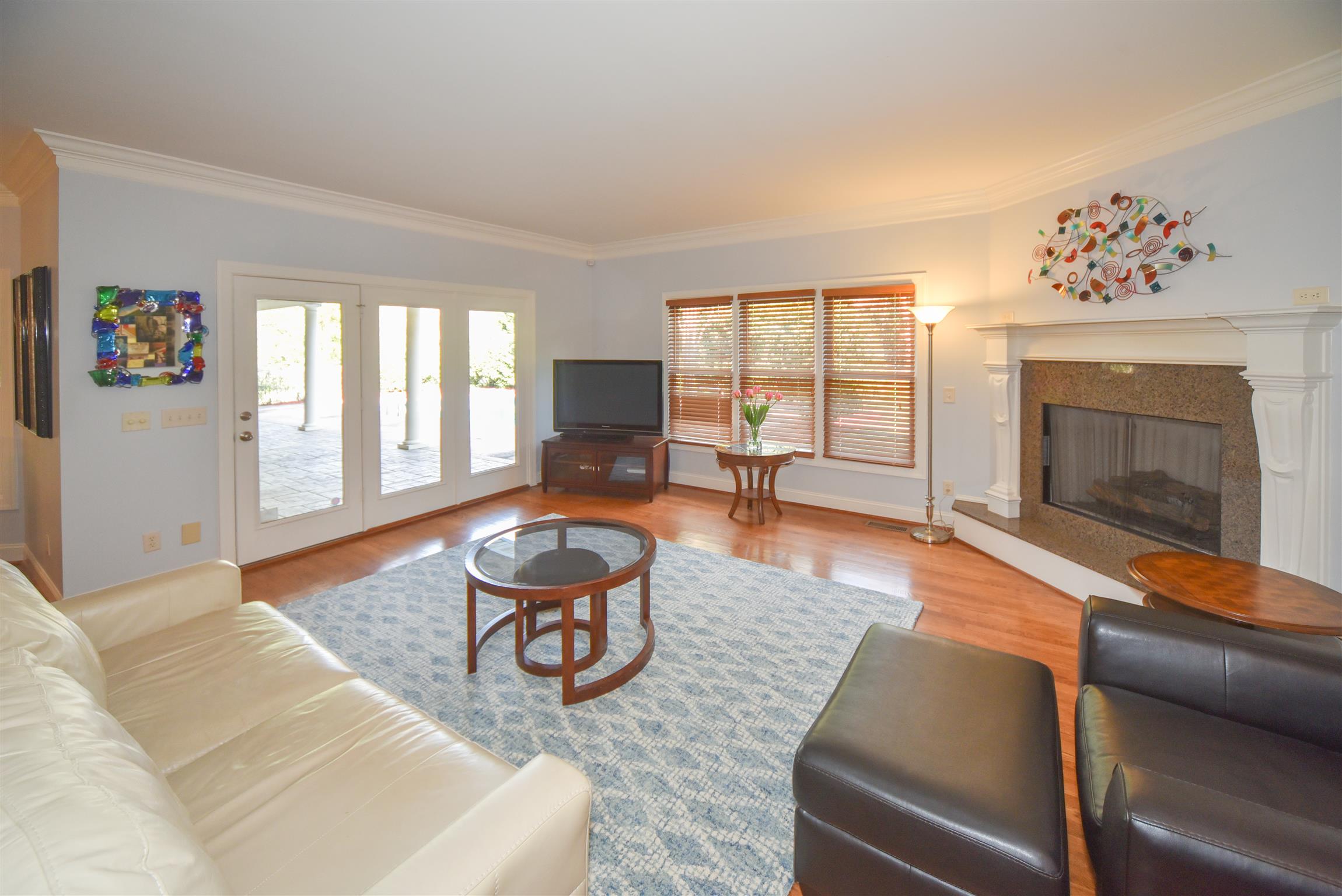 388 Sandcastle Road Franklin, TN 37069 - Photo 9 of 30 Living Room with pool view & gas fireplace