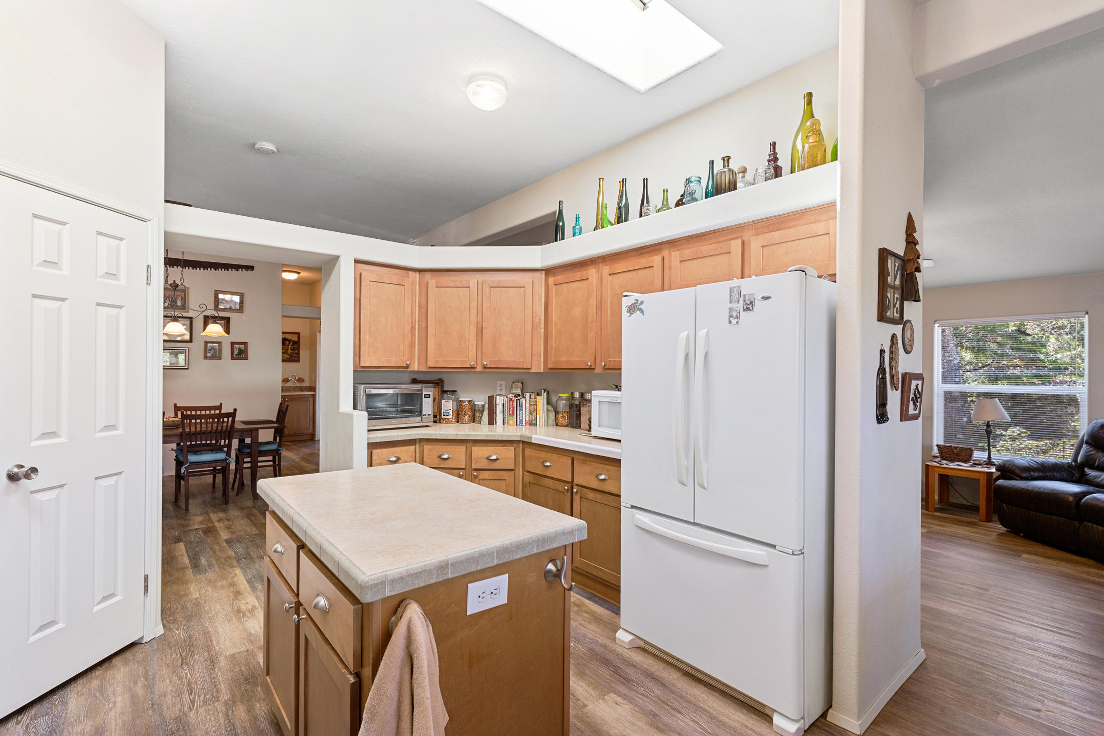 4550 Holland Loop Road Cave Junction, OR 97523 - Photo 8 of 39 a white refrigerator freezer sitting in a kitchen