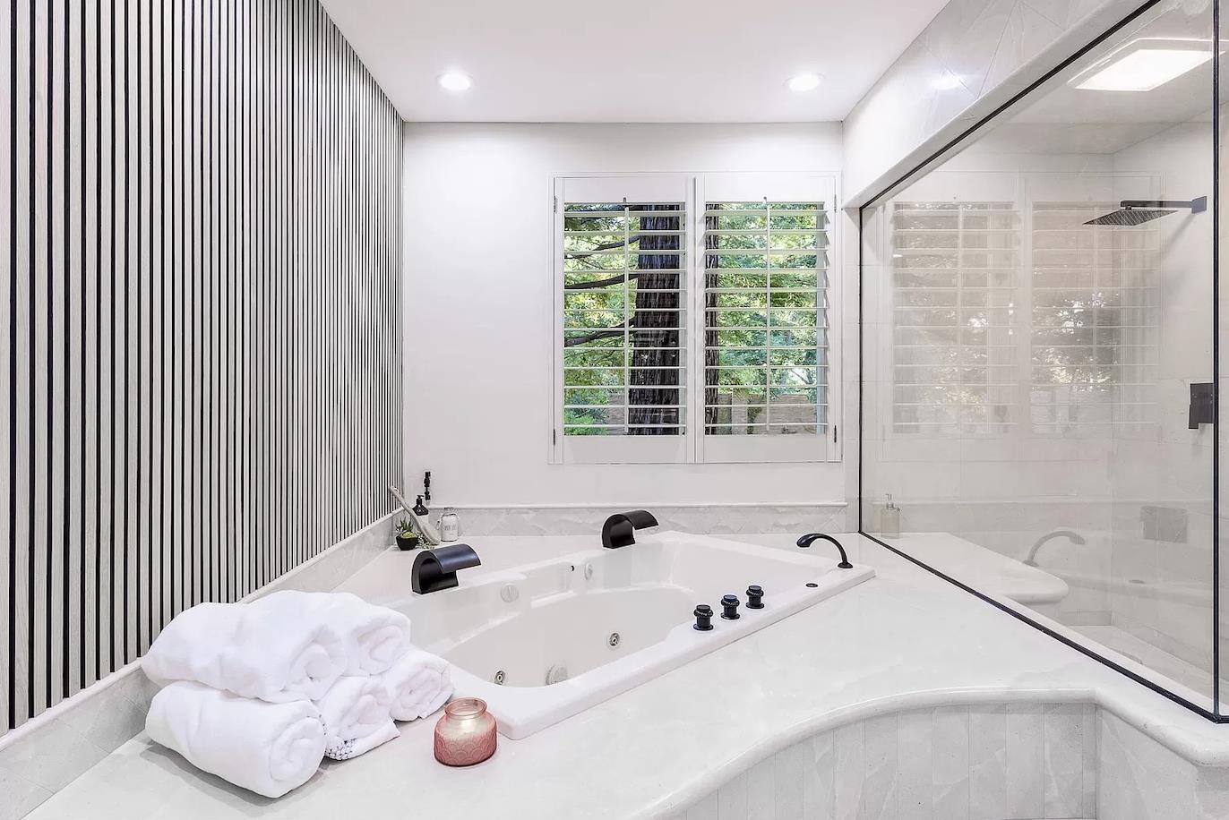 12 Vineyard Hill Road Woodside, CA 94062 - Photo 11 of 21 a bathroom with a tub and a shower