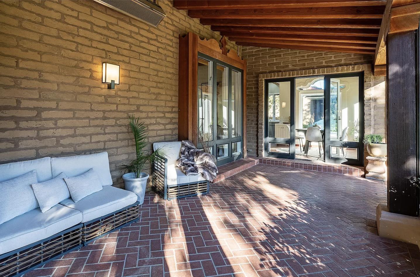 12 Vineyard Hill Road Woodside, CA 94062 - Photo 15 of 21 a balcony with furniture and large windows
