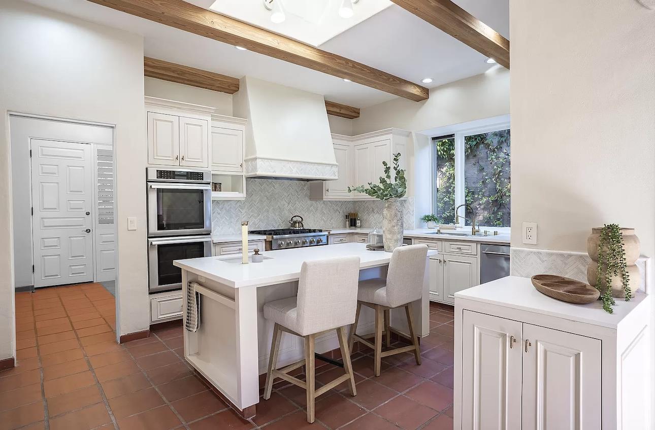 12 Vineyard Hill Road Woodside, CA 94062 - Photo 6 of 21 a kitchen that has a lot of cabinets in it and appliances