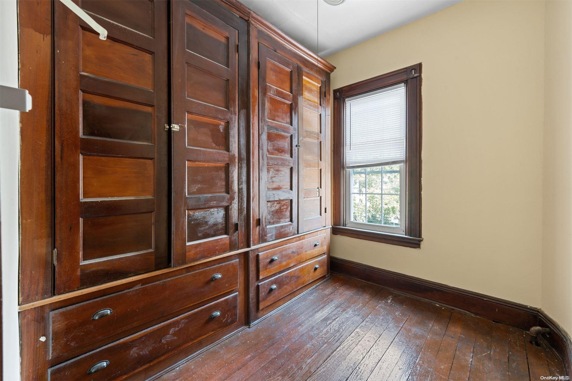 85-70 79th Street Queens, NY 11421 - Photo 12 of 18 a view of an empty room and window