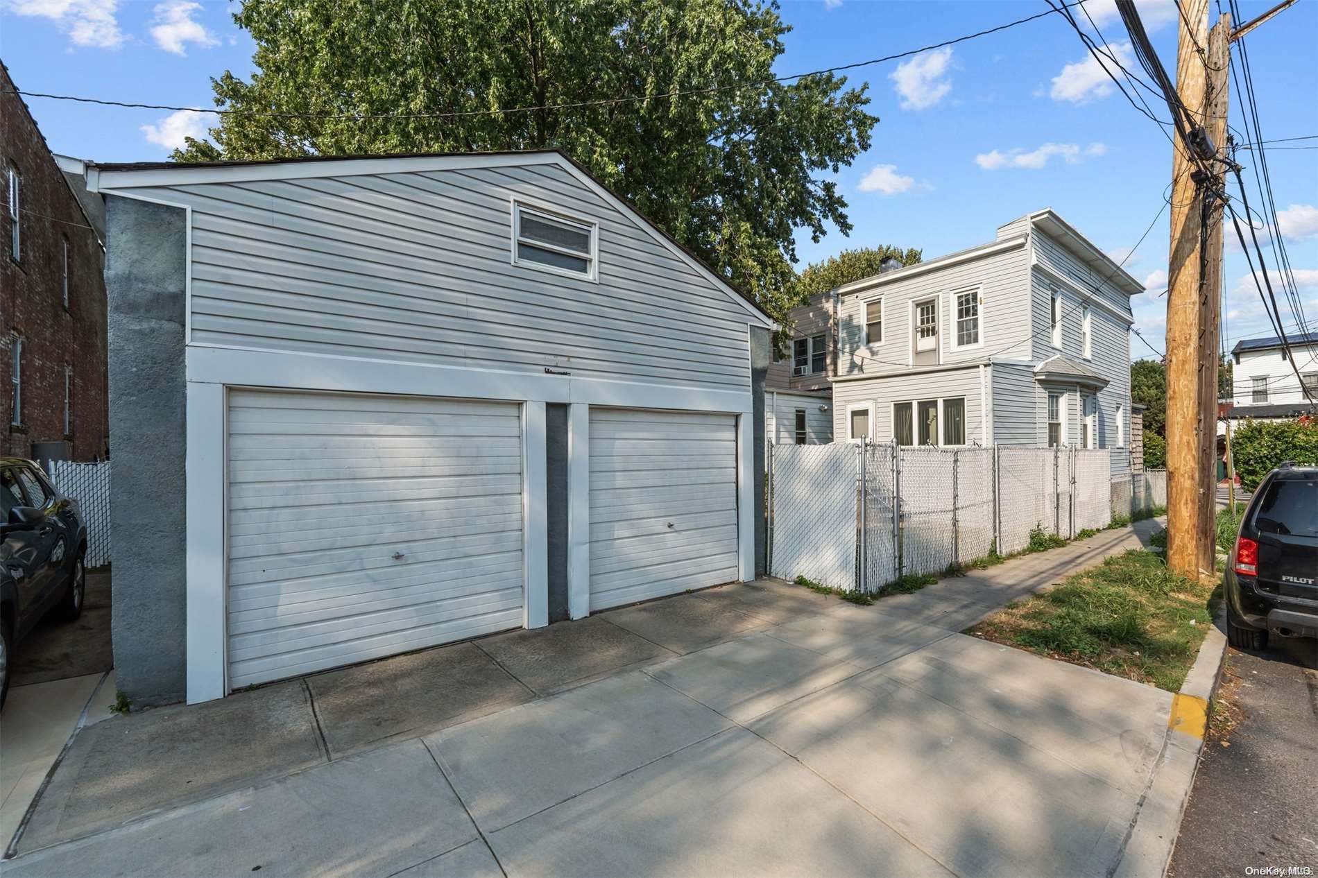 85-70 79th Street Queens, NY 11421 - Photo 15 of 18 a view of a house with a yard