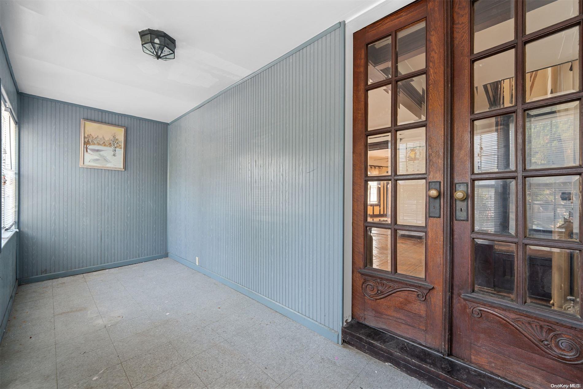 85-70 79th Street Queens, NY 11421 - Photo 2 of 18 an empty room with windows