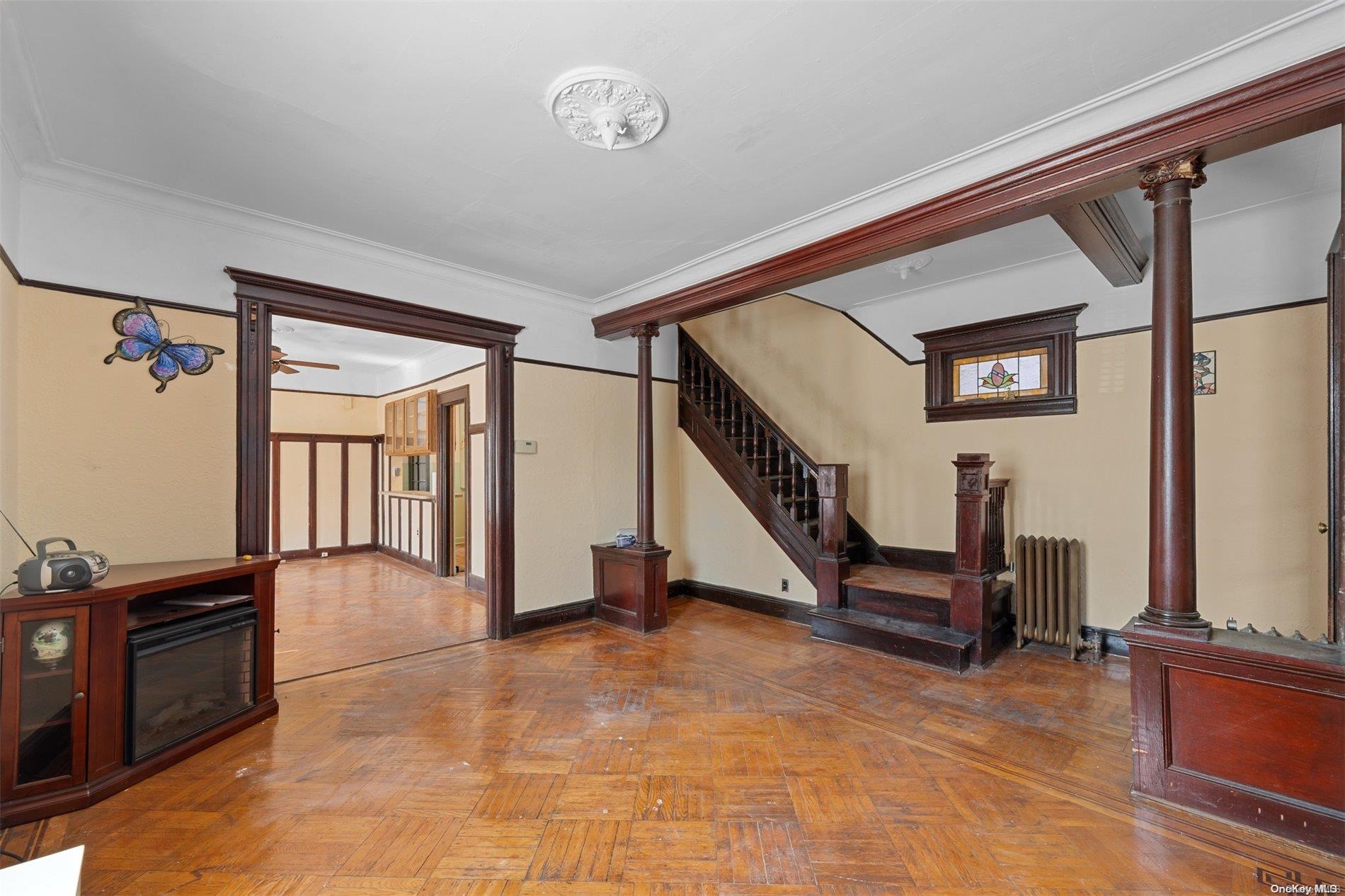 85-70 79th Street Queens, NY 11421 - Photo 3 of 18 a view of front door with furniture and a ceiling fan