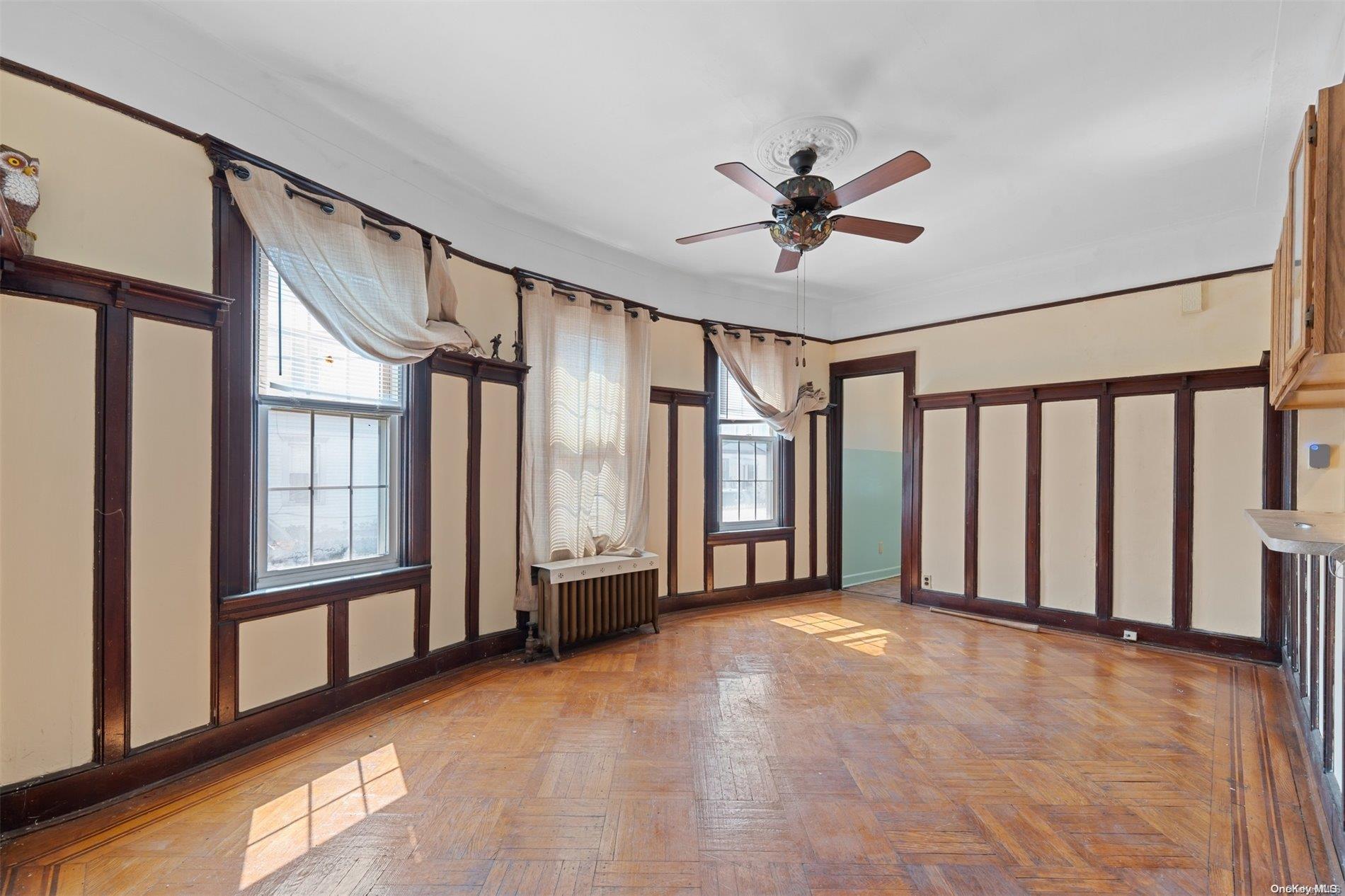 85-70 79th Street Queens, NY 11421 - Photo 5 of 18 a view of an empty room with a window