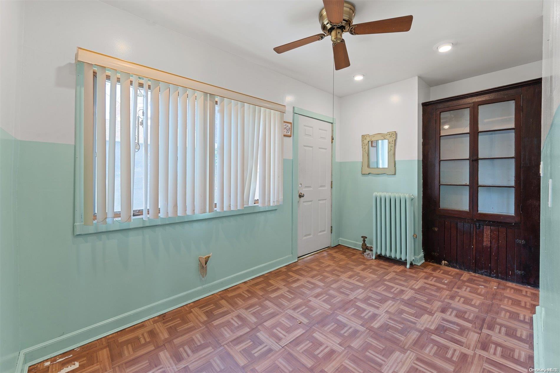 85-70 79th Street Queens, NY 11421 - Photo 8 of 18 a view of an empty room with a window
