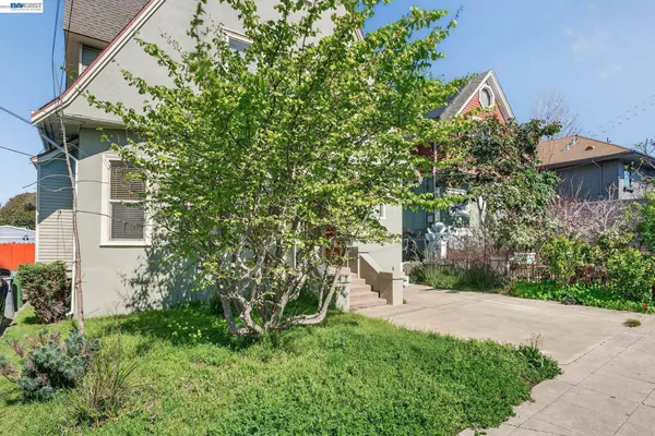 a view of a hallway with wooden floor and closet area