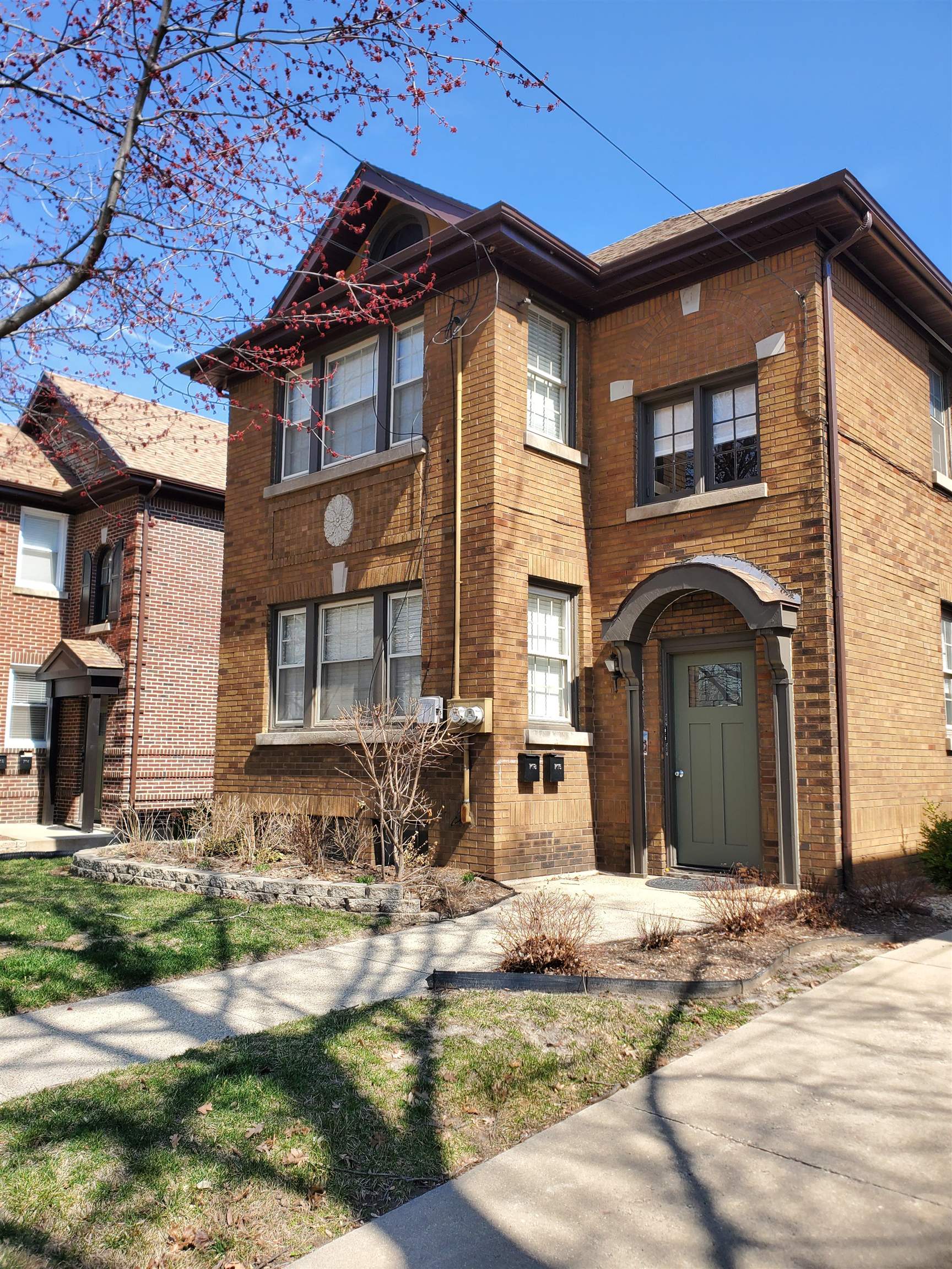 718 Seminary Street Rockford, IL 61104 - Photo 1 of 18 a front view of a house with garden