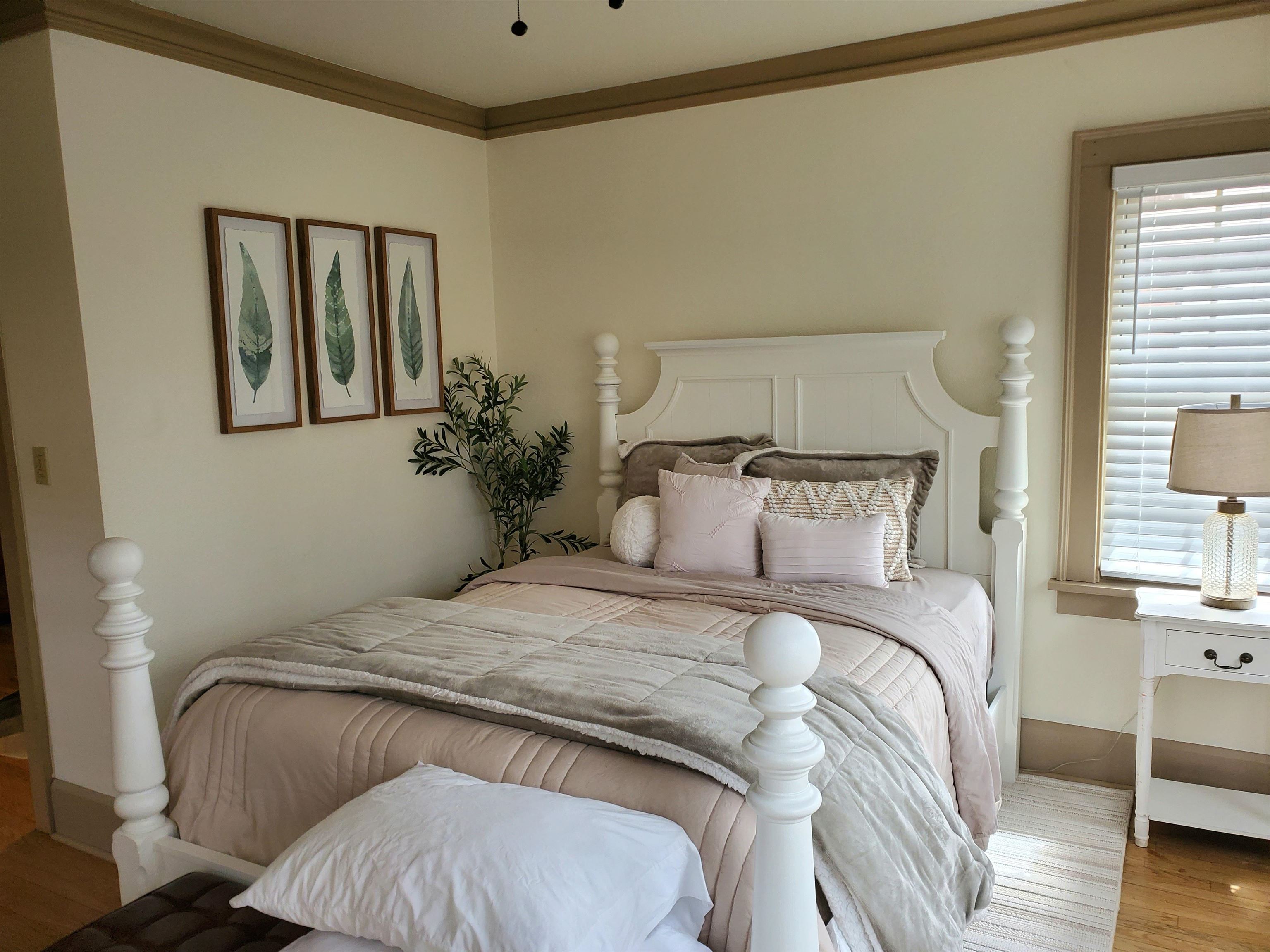 718 Seminary Street Rockford, IL 61104 - Photo 12 of 18 a bedroom with a bed and a potted plant