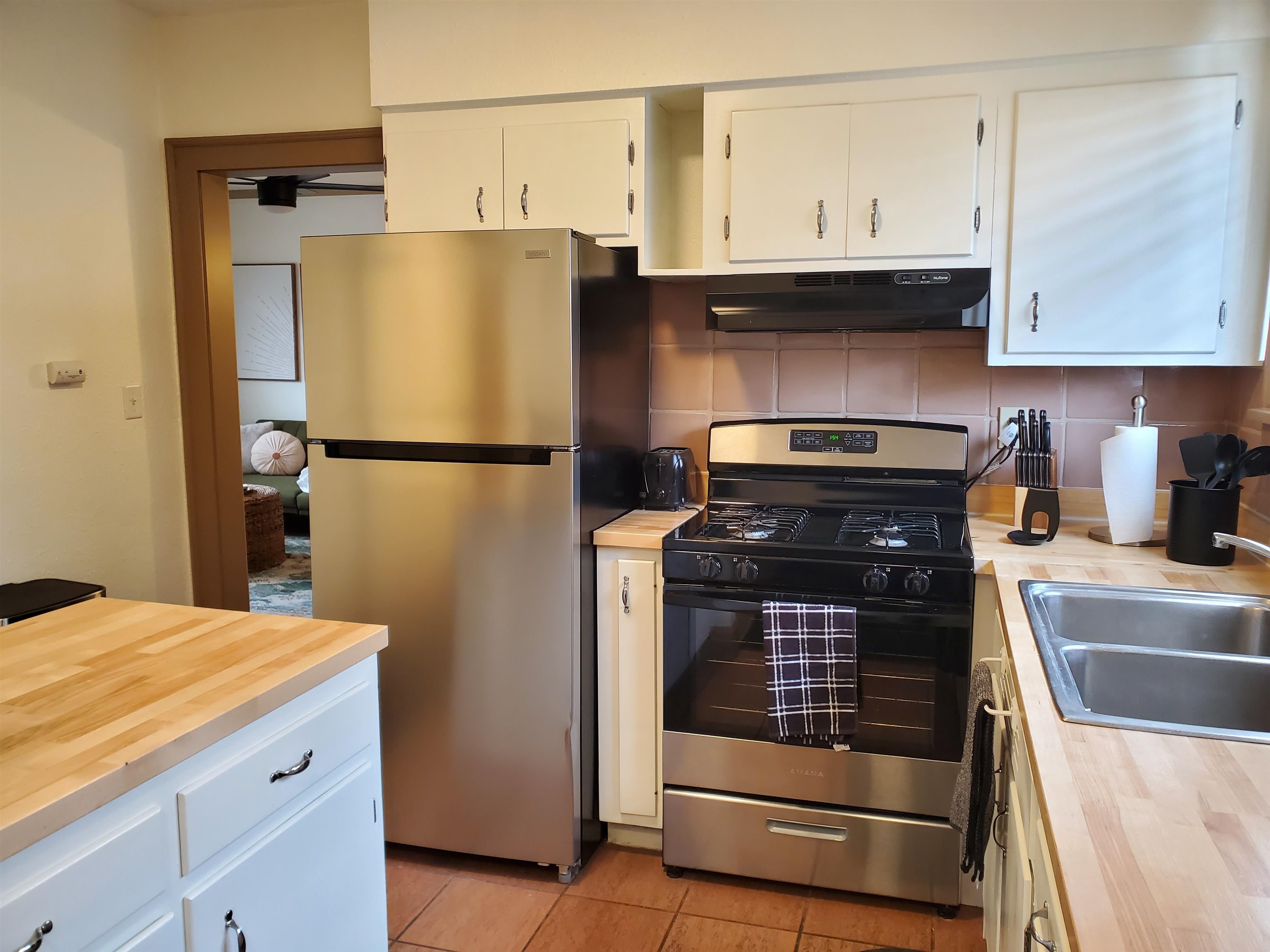 718 Seminary Street Rockford, IL 61104 - Photo 14 of 18 a kitchen with stainless steel appliances a refrigerator and a sink