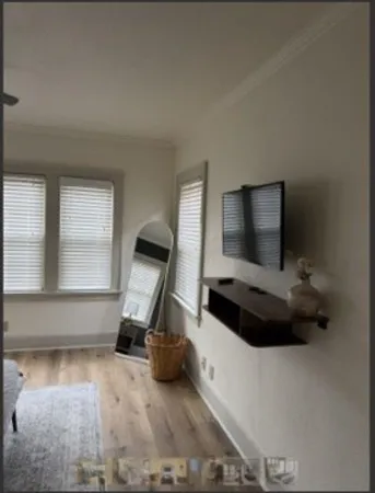 a living room with a flat screen tv and a fireplace