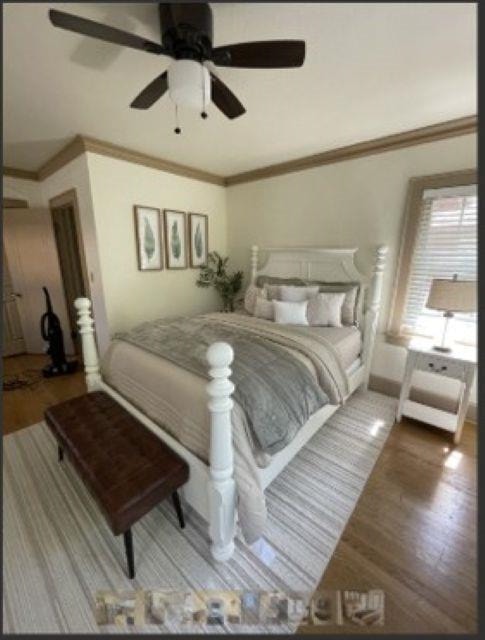 718 Seminary Street Rockford, IL 61104 - Photo 8 of 18 a bedroom with a bed and a chandelier