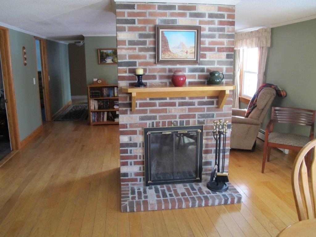 212 Bassett Road Winslow, ME 04901 - Photo 12 of 32 Dining Room Fireplace