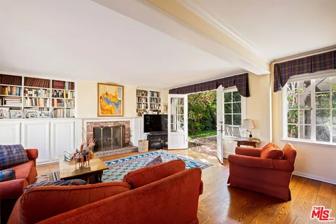 a living room with furniture window and flat screen tv