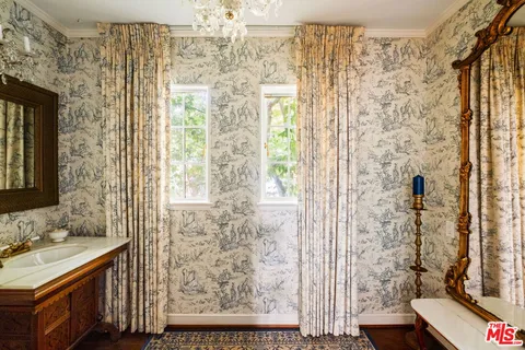 a bathroom with a shower curtain and a sink