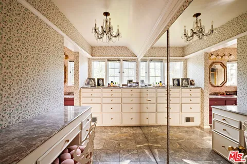 a kitchen with stainless steel appliances granite countertop a stove and cabinets