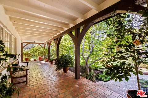 a lobby with furniture and a garden