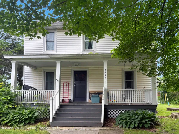 a view of a workspace with furniture and a chandelier