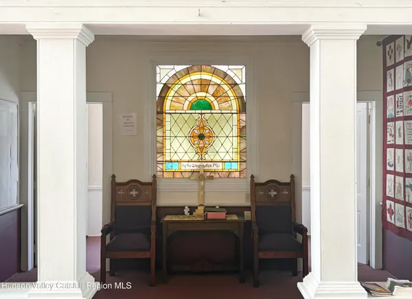a living room with furniture and a window