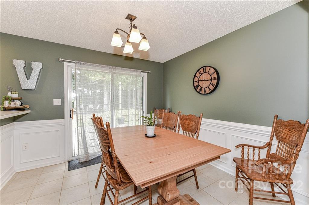 2215 Genesis Drive Monroe, NC 28110 - Photo 13 of 29 a view of a dining room with furniture window and outside view