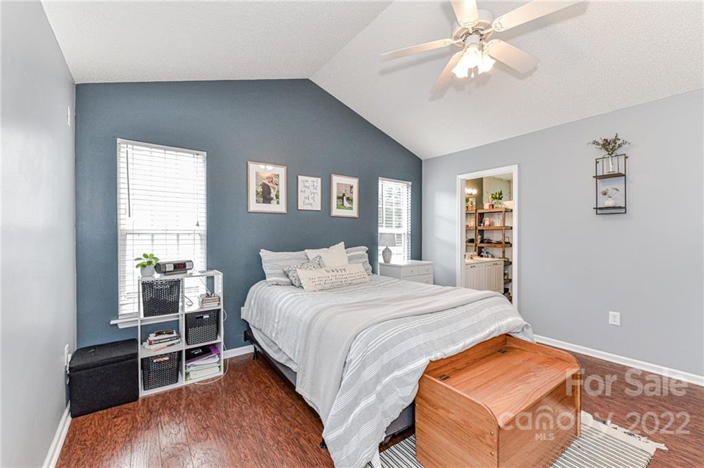2215 Genesis Drive Monroe, NC 28110 - Photo 15 of 29 a bedroom with a bed and a chandelier