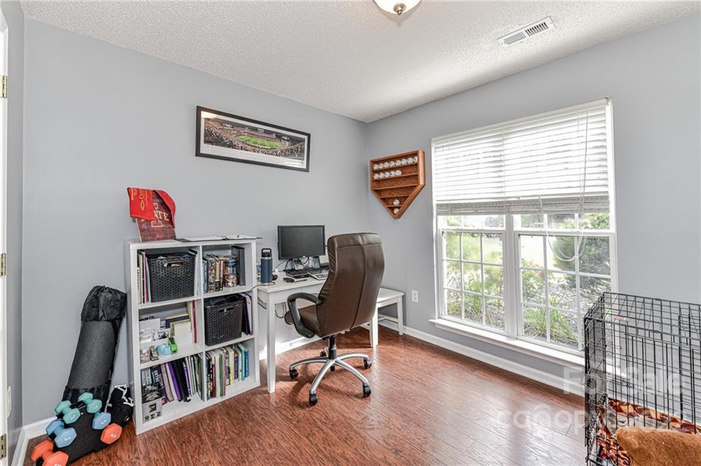 2215 Genesis Drive Monroe, NC 28110 - Photo 19 of 29 a view of a workspace with furniture and a window