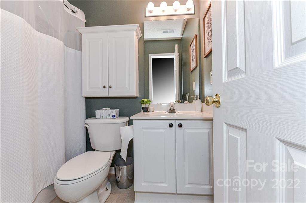 2215 Genesis Drive Monroe, NC 28110 - Photo 20 of 29 a bathroom with a toilet sink and mirror