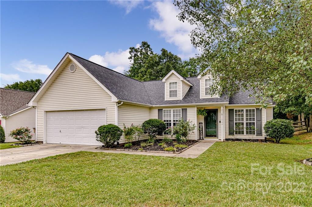 2215 Genesis Drive Monroe, NC 28110 - Photo 2 of 29 a front view of a house with a garden