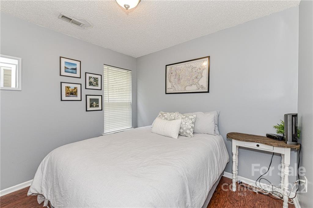 2215 Genesis Drive Monroe, NC 28110 - Photo 21 of 29 a bedroom with a bed and a cabinets