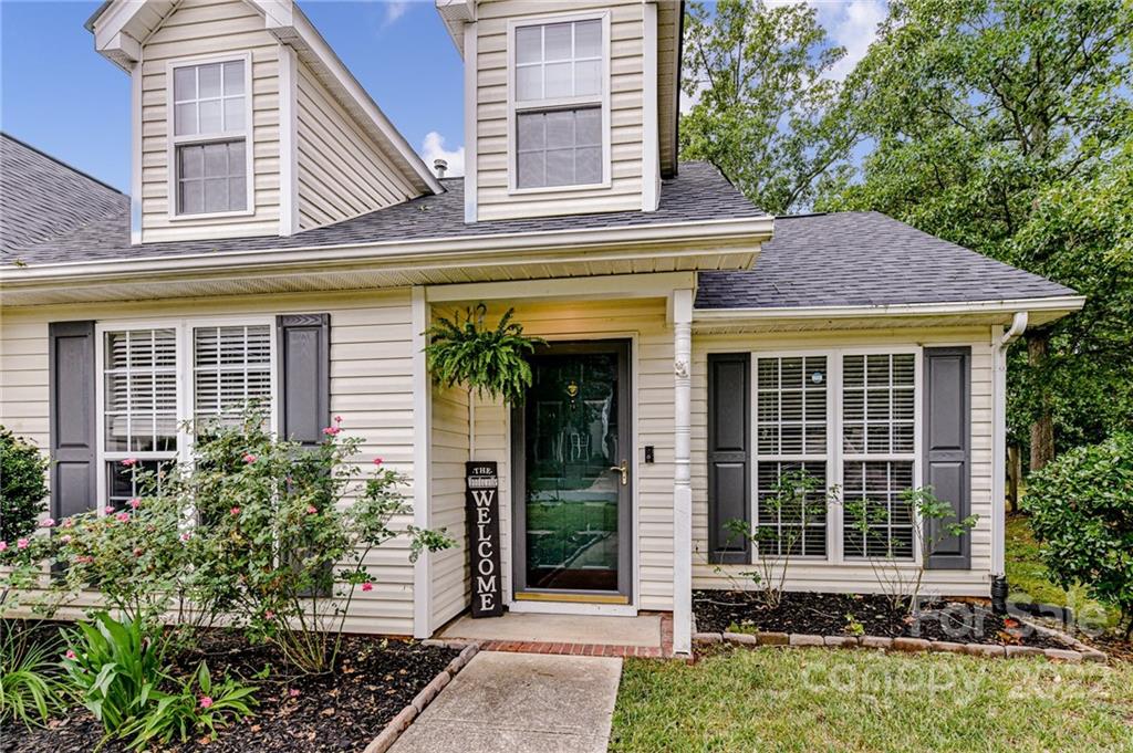 2215 Genesis Drive Monroe, NC 28110 - Photo 3 of 29 a front view of a house with garden