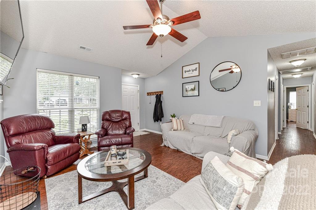 2215 Genesis Drive Monroe, NC 28110 - Photo 8 of 29 a living room with furniture a rug and a window