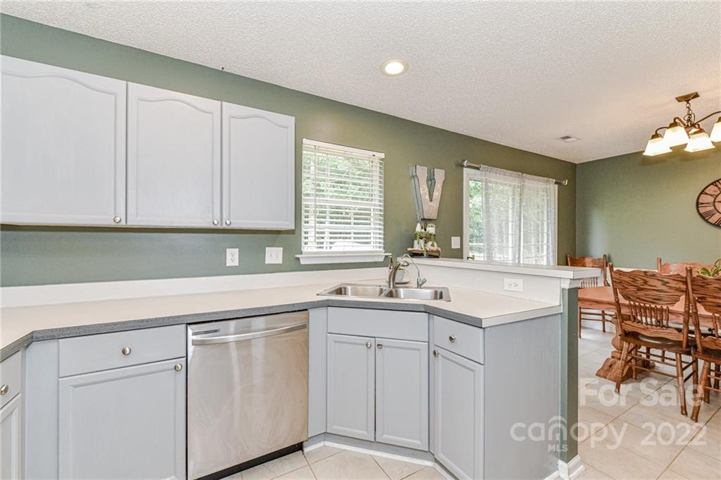 2215 Genesis Drive Monroe, NC 28110 - Photo 9 of 29 a kitchen with cabinets and sink