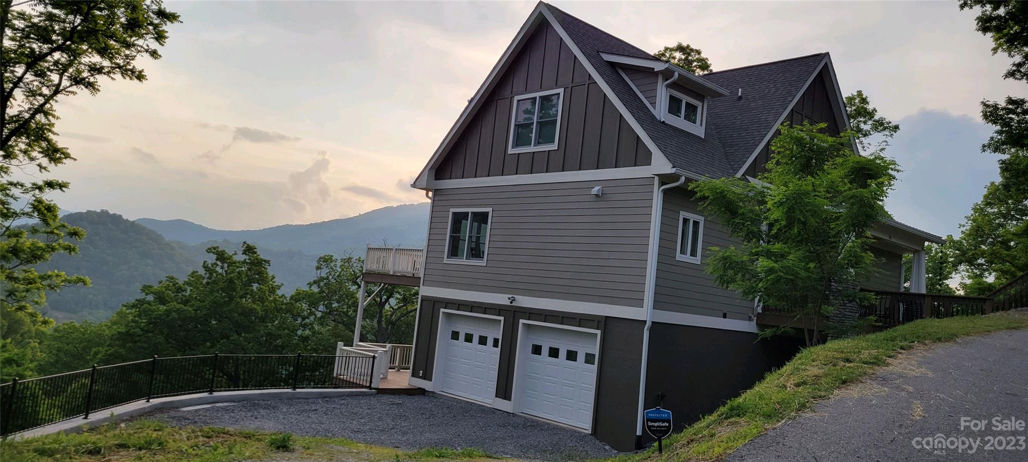 0 Rons Ridge, Unit 43 Waynesville, NC 28785 - Photo 3 of 4 a front view of a house with garden