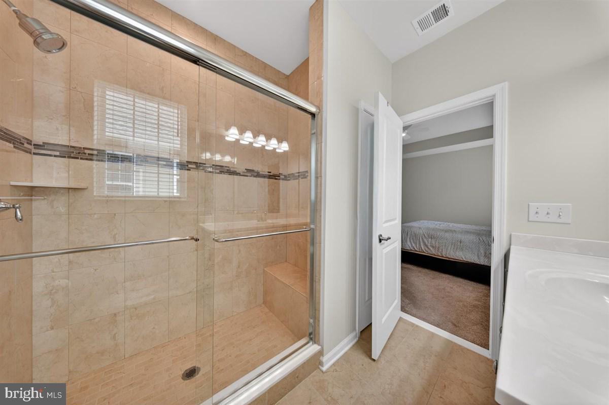 1426 Whispering Woods Road Middletown, DE 19709 - Photo 21 of 37 a bathroom that has a glass shower door