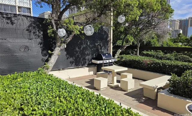 a view of a house with a pool and garden