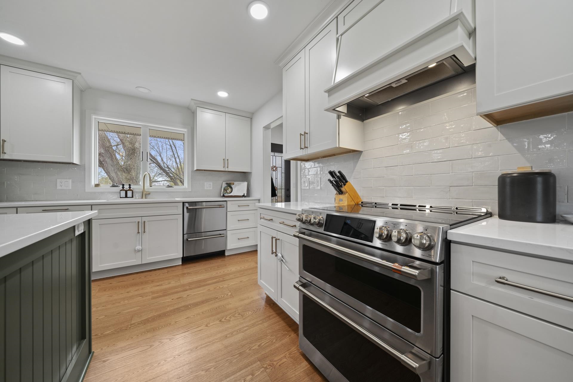 3075 East Water Road Byron, IL 61010 - Photo 11 of 46 a kitchen with stainless steel appliances a stove microwave and cabinets