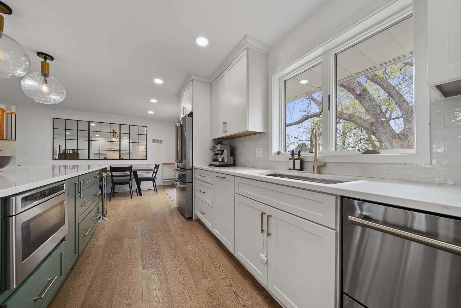 3075 East Water Road Byron, IL 61010 - Photo 12 of 46 a kitchen with lots of counter top space and wooden floor