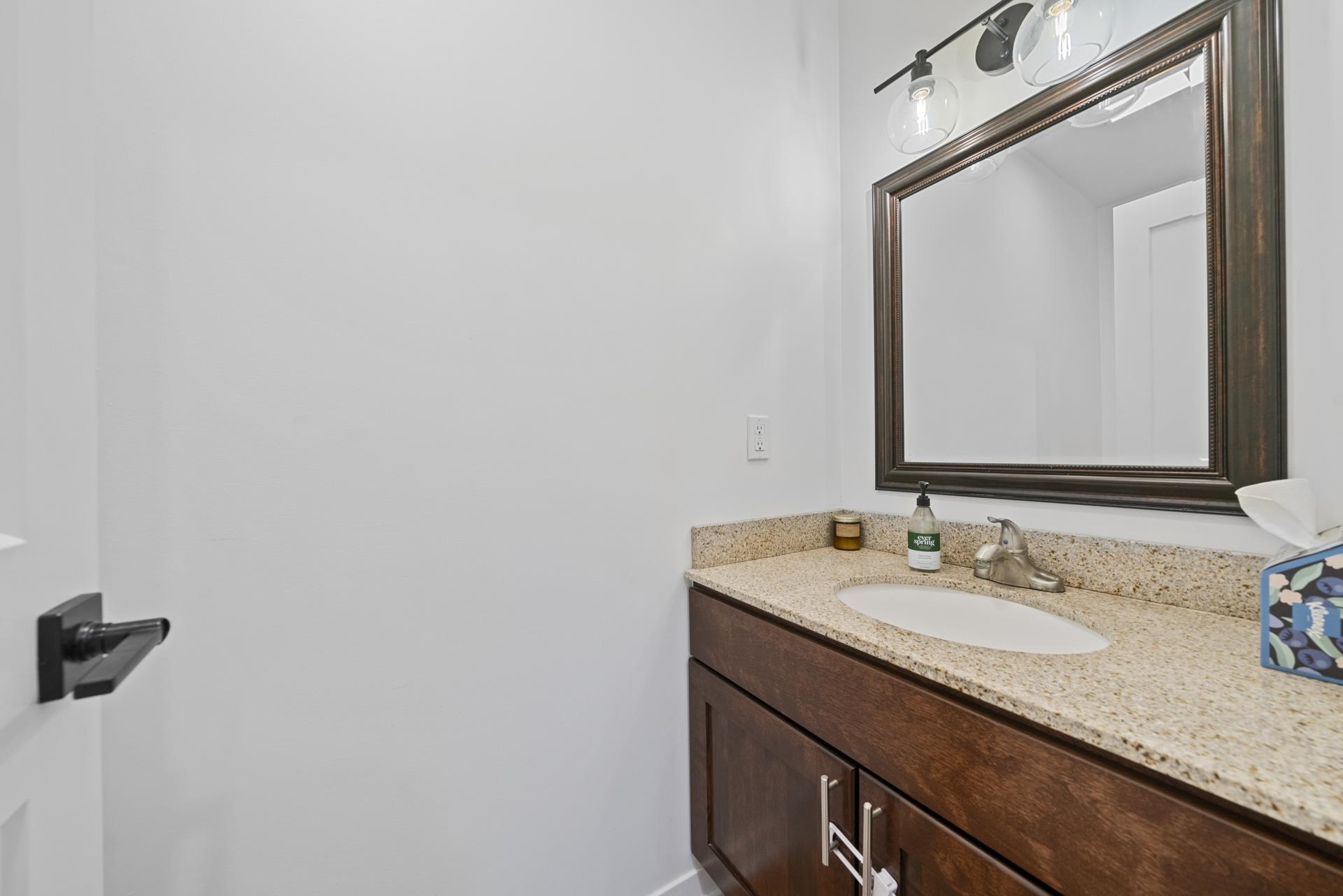 3075 East Water Road Byron, IL 61010 - Photo 16 of 46 a bathroom with a granite countertop sink and a mirror