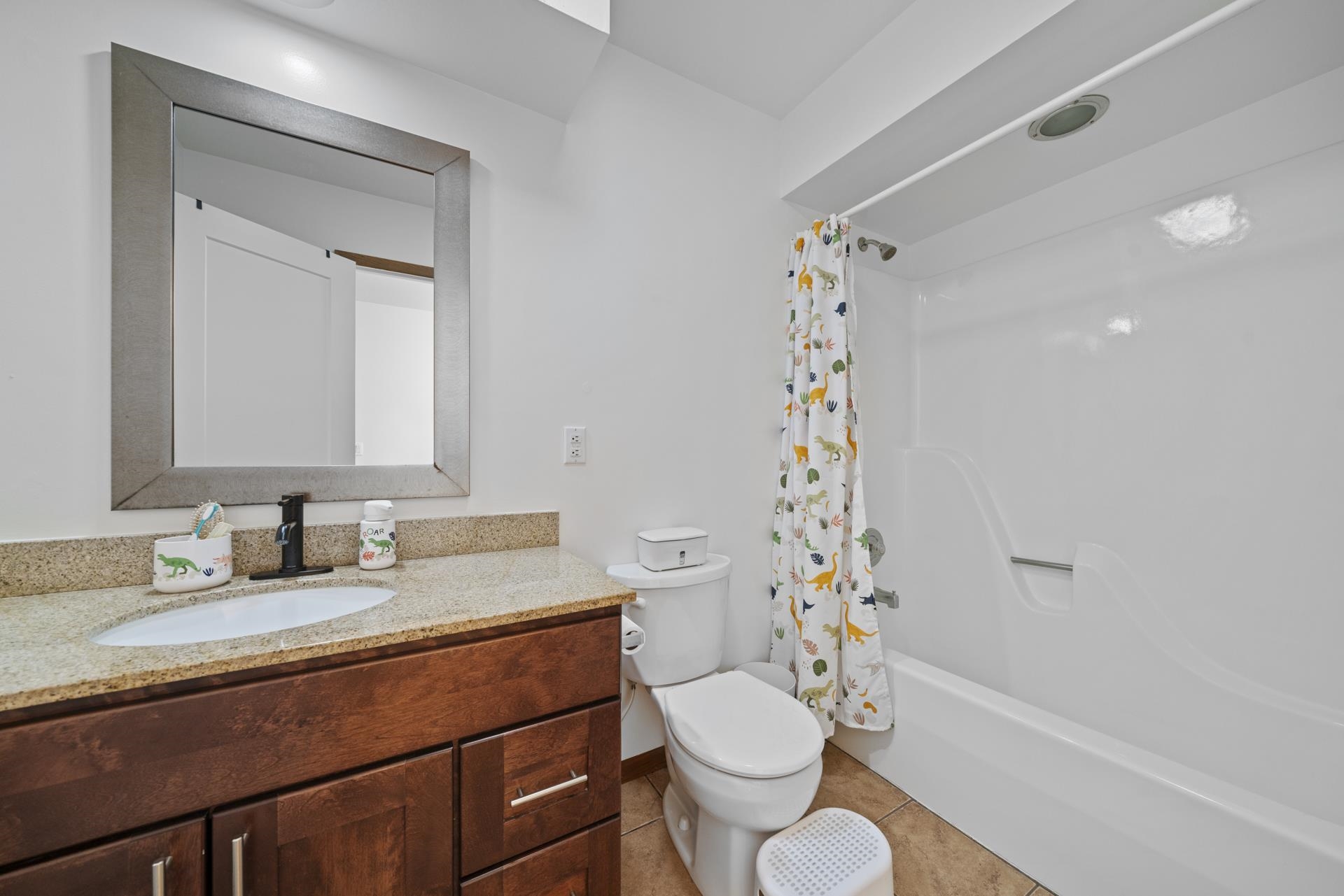 3075 East Water Road Byron, IL 61010 - Photo 17 of 46 a bathroom with a sink a toilet and shower