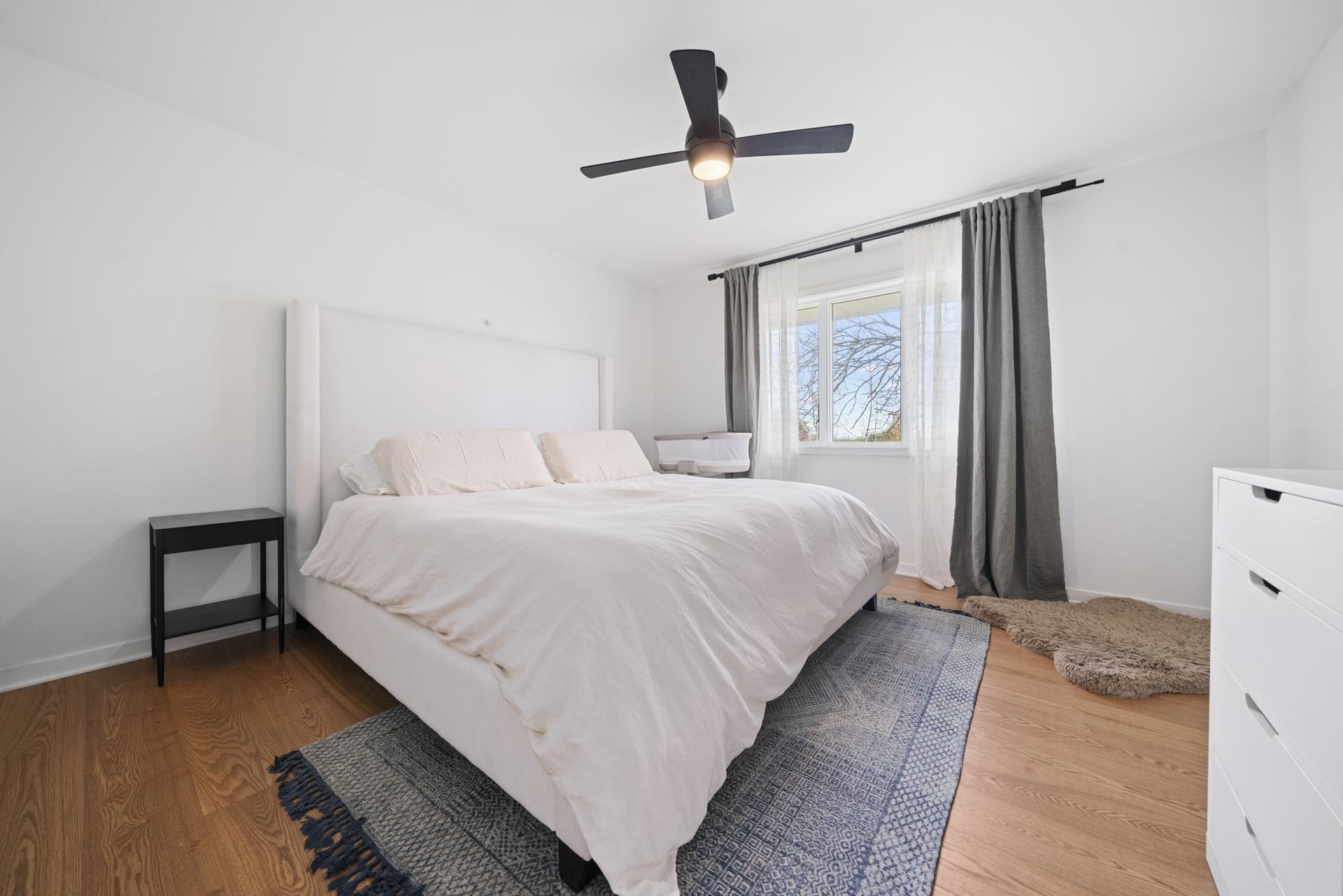 3075 East Water Road Byron, IL 61010 - Photo 19 of 46 a bedroom with a bed mirror and a window