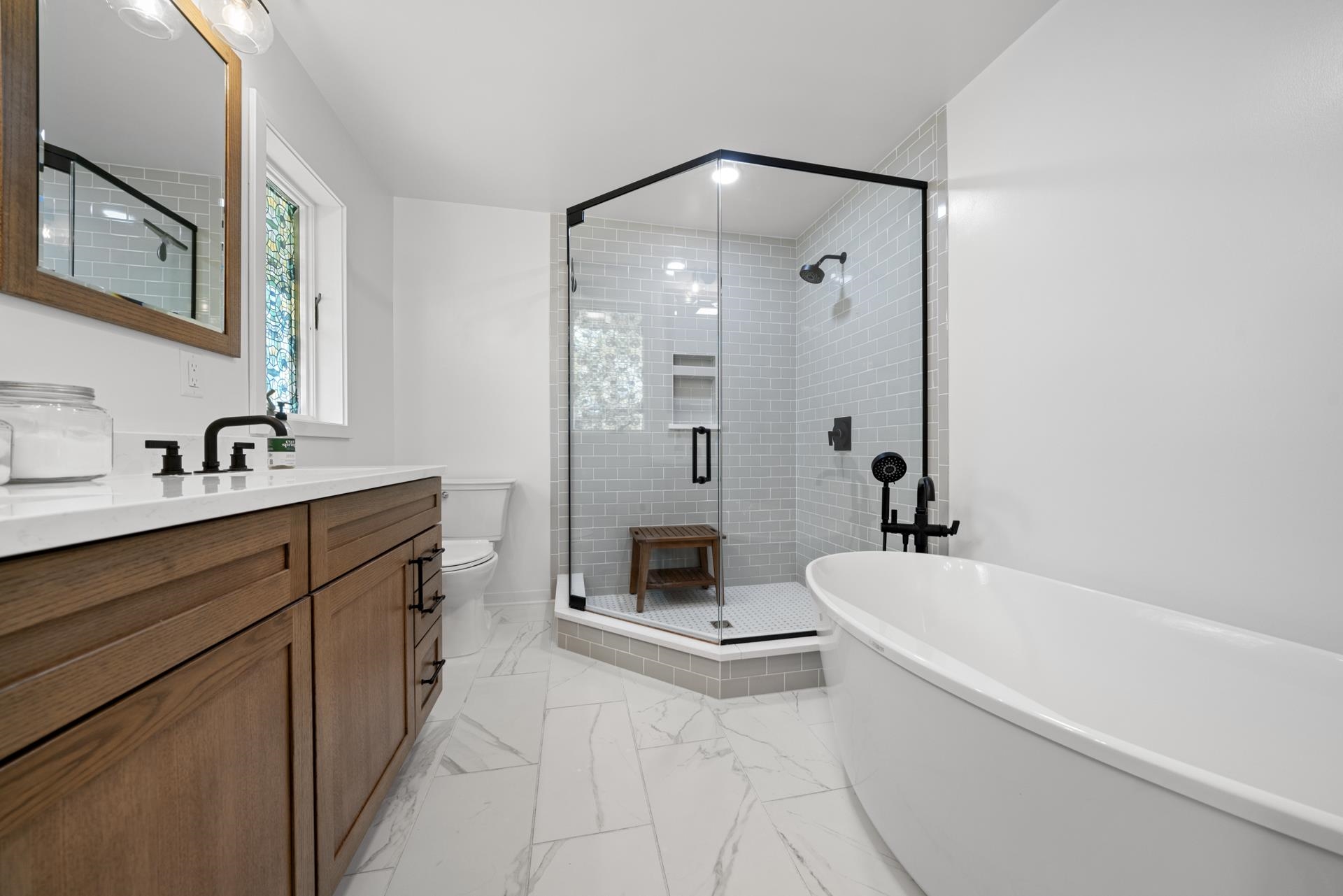 3075 East Water Road Byron, IL 61010 - Photo 22 of 46 a spacious bathroom with a tub sink and mirror