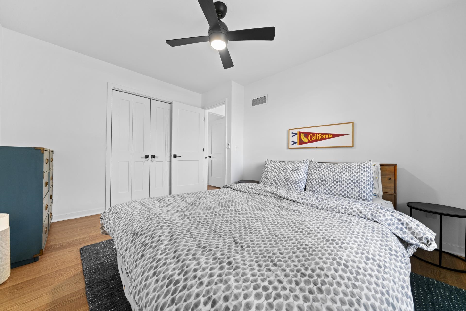 3075 East Water Road Byron, IL 61010 - Photo 24 of 46 a bedroom with a bed and a chandelier