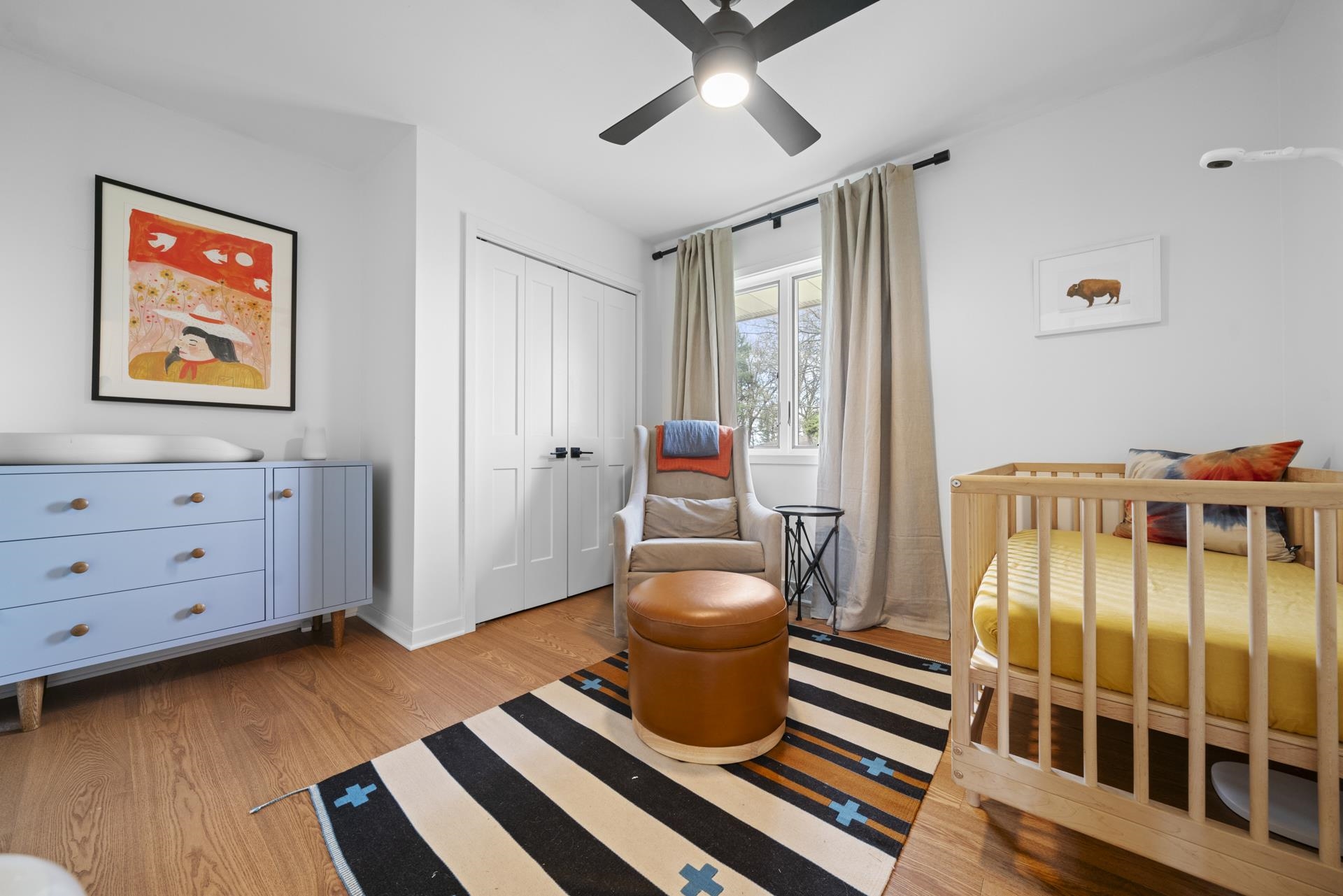 3075 East Water Road Byron, IL 61010 - Photo 25 of 46 a bedroom with a bed and wooden floor